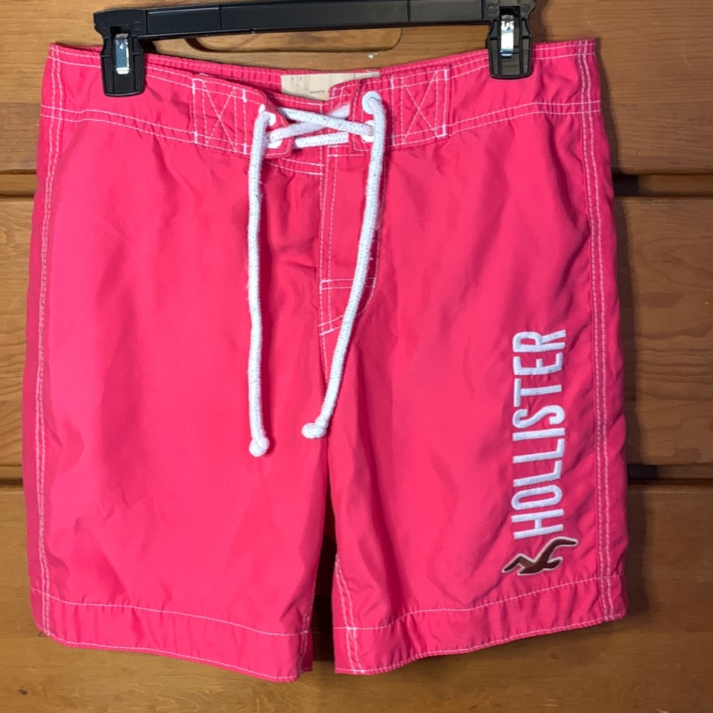 Hollister board shorts in bright pink. Size small. Some slight wear shown.